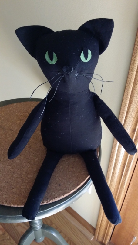 Stuffed black cat.